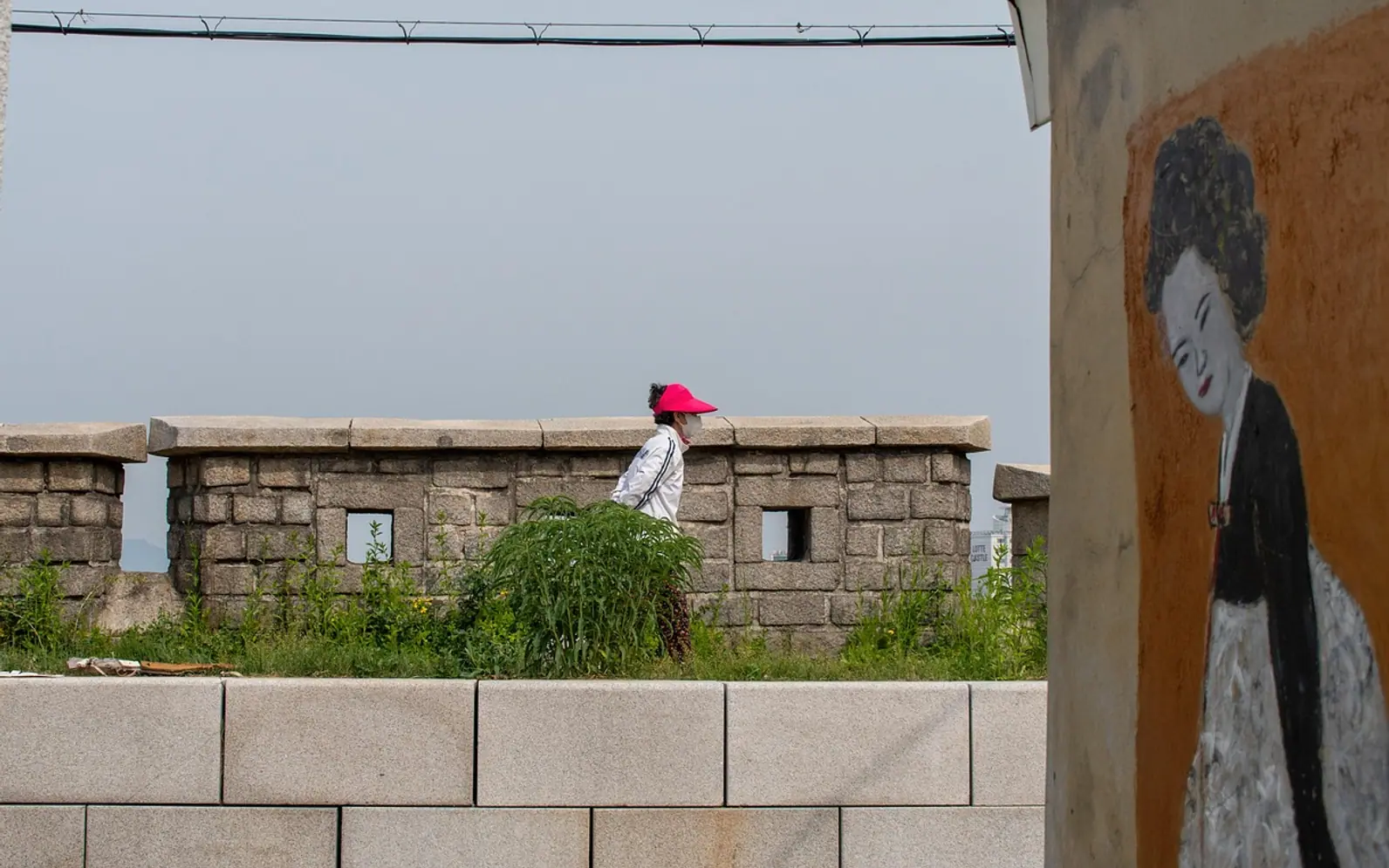 Woman, wall and city