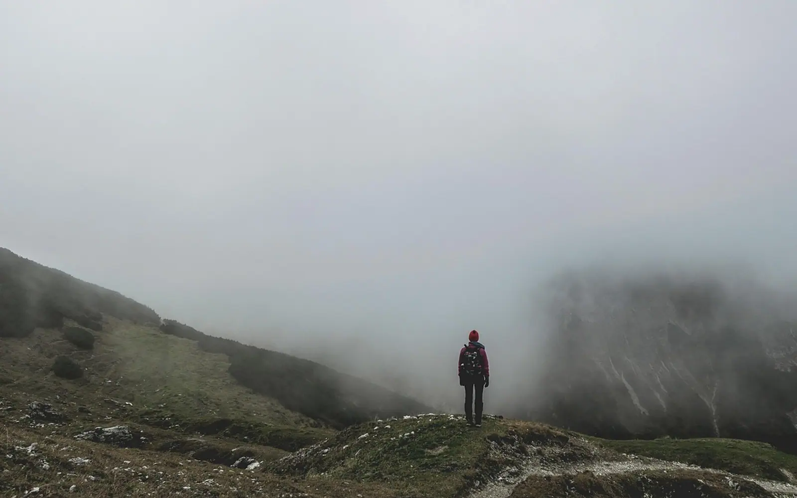 Backpacker, mountains and fog